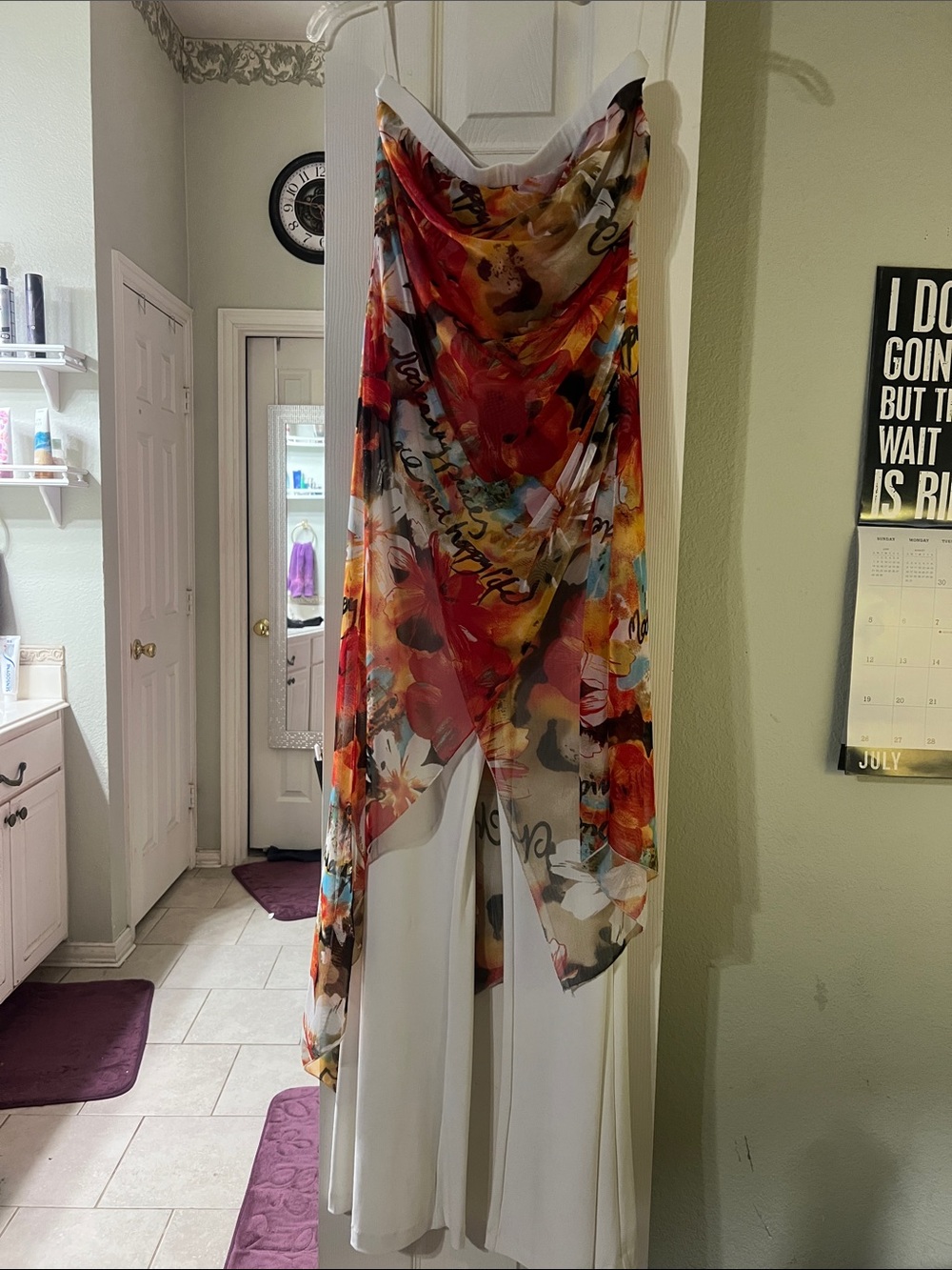 An over the shoulder outfit.  White Top with Red and Yellow Floral Sheer Overlay